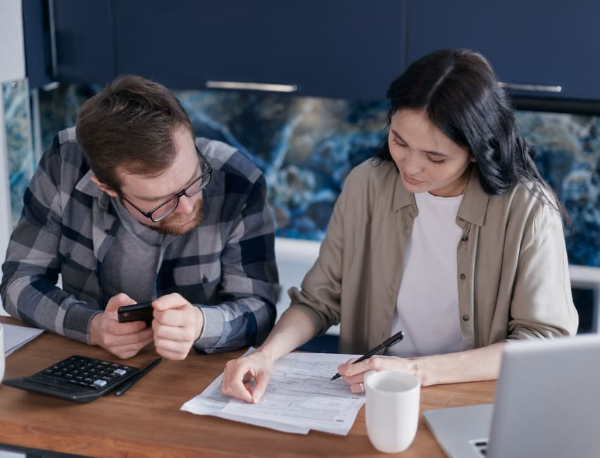 Couple Signing Divorce Papers - uncontested divorce dallas