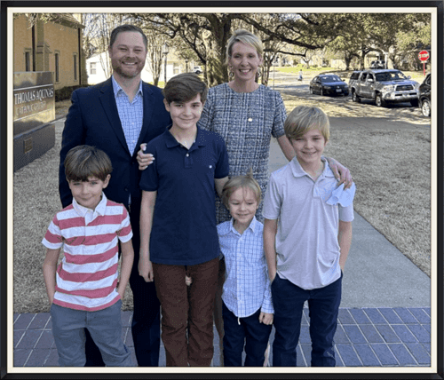 Director of Operations, Coy Morgan, and his wife and children
