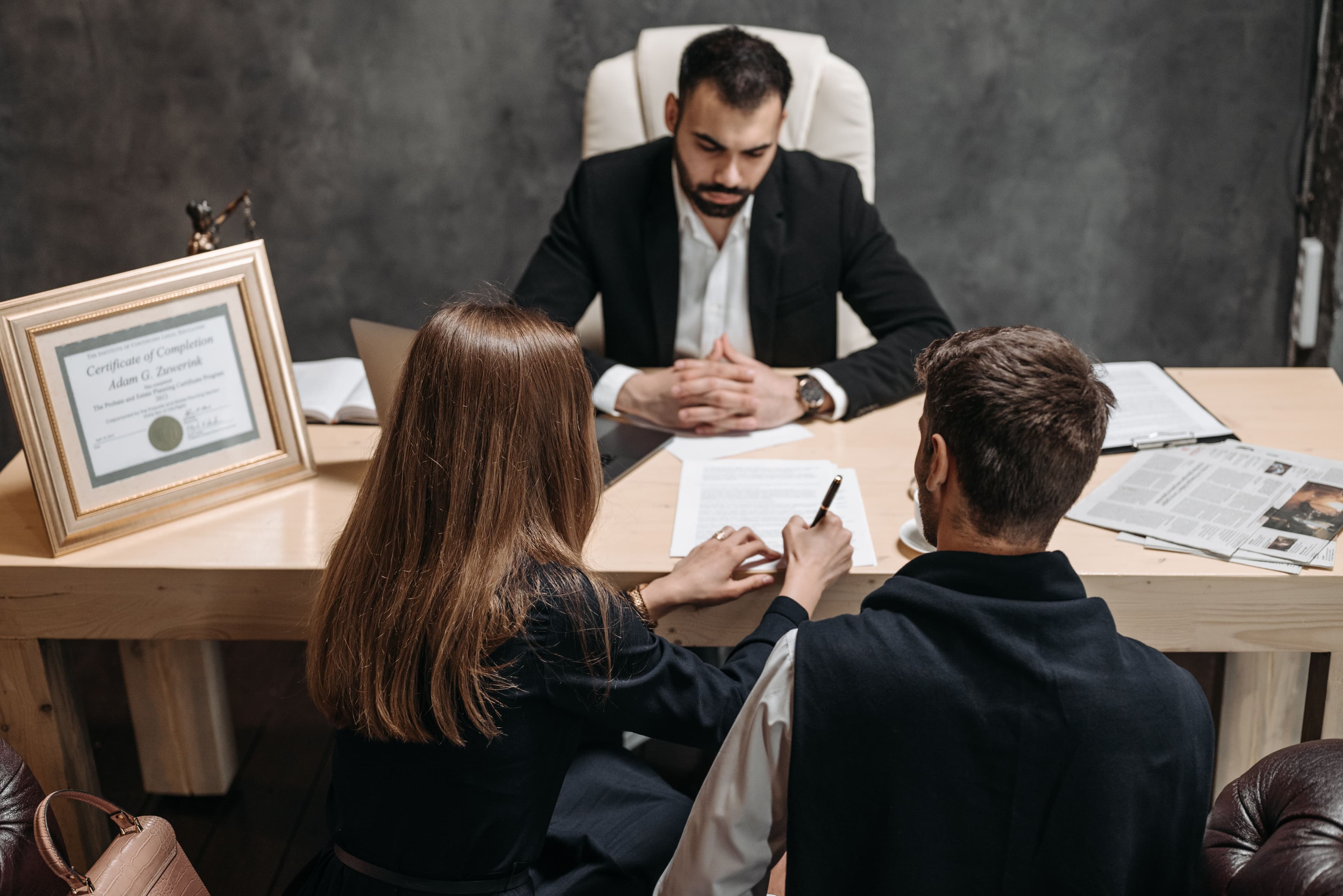 Attorney consulting with parents about child custody arrangements