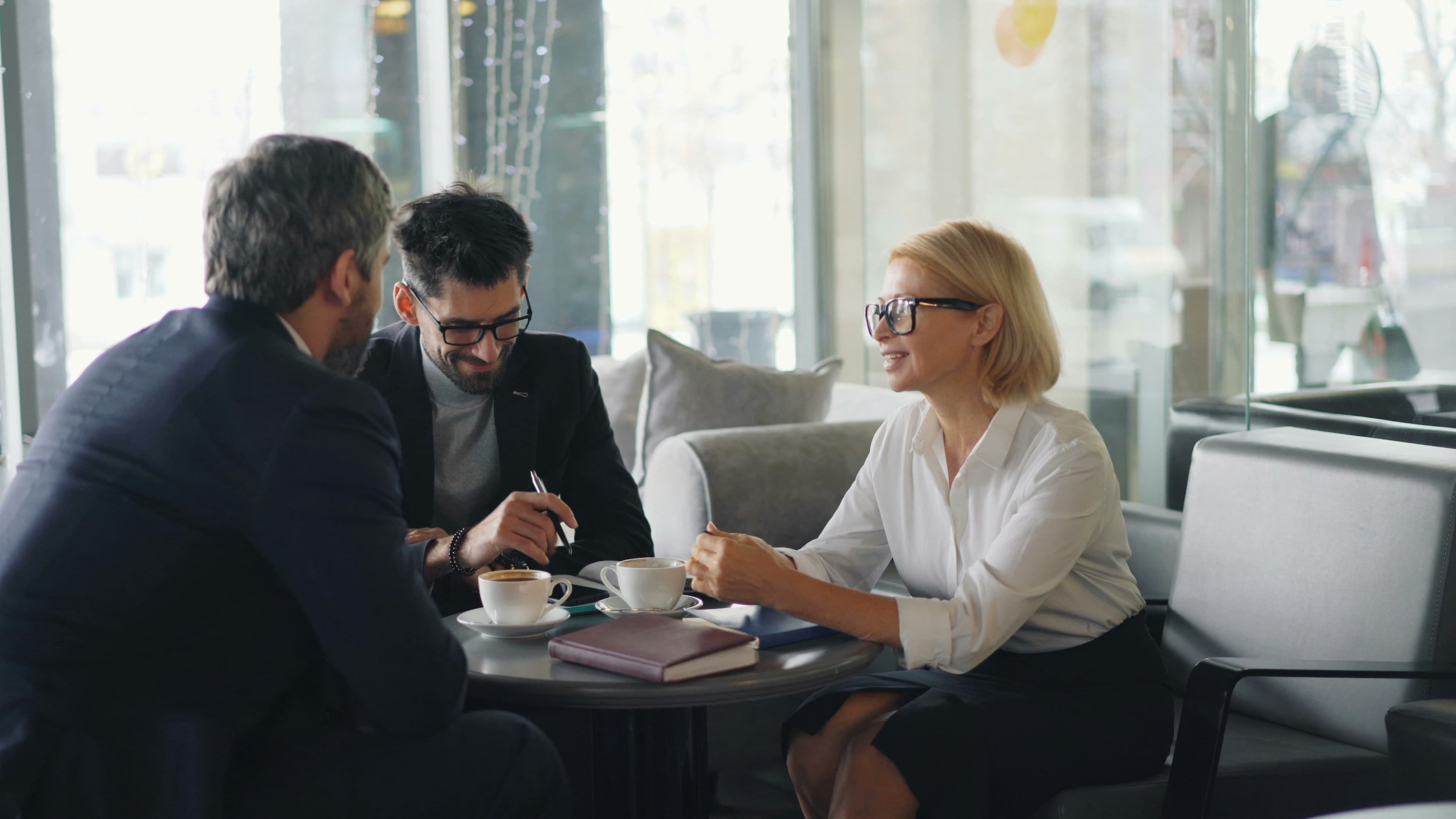 Professionals reviewing child support documents in a meeting