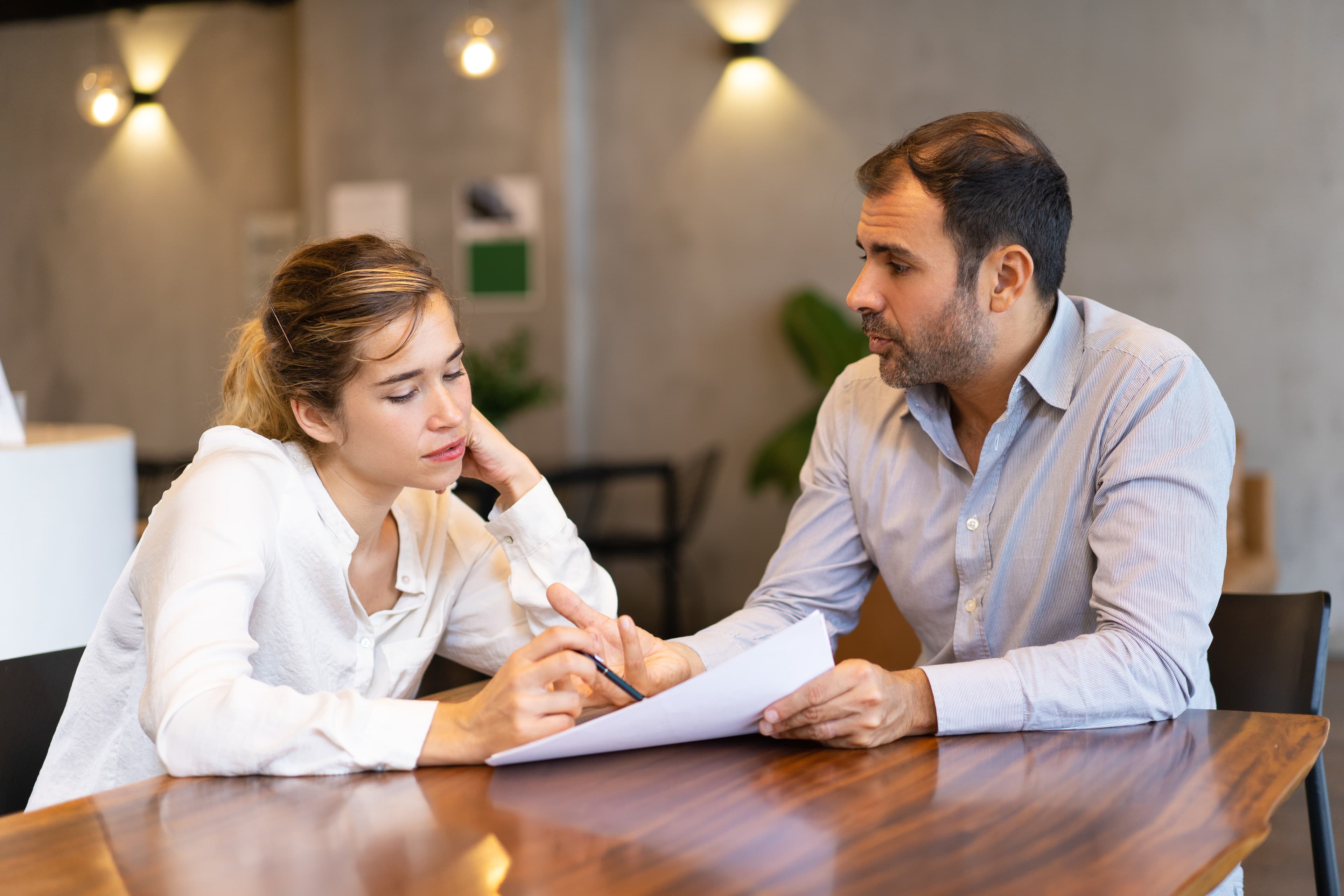 Parents reviewing documents during a family discussion