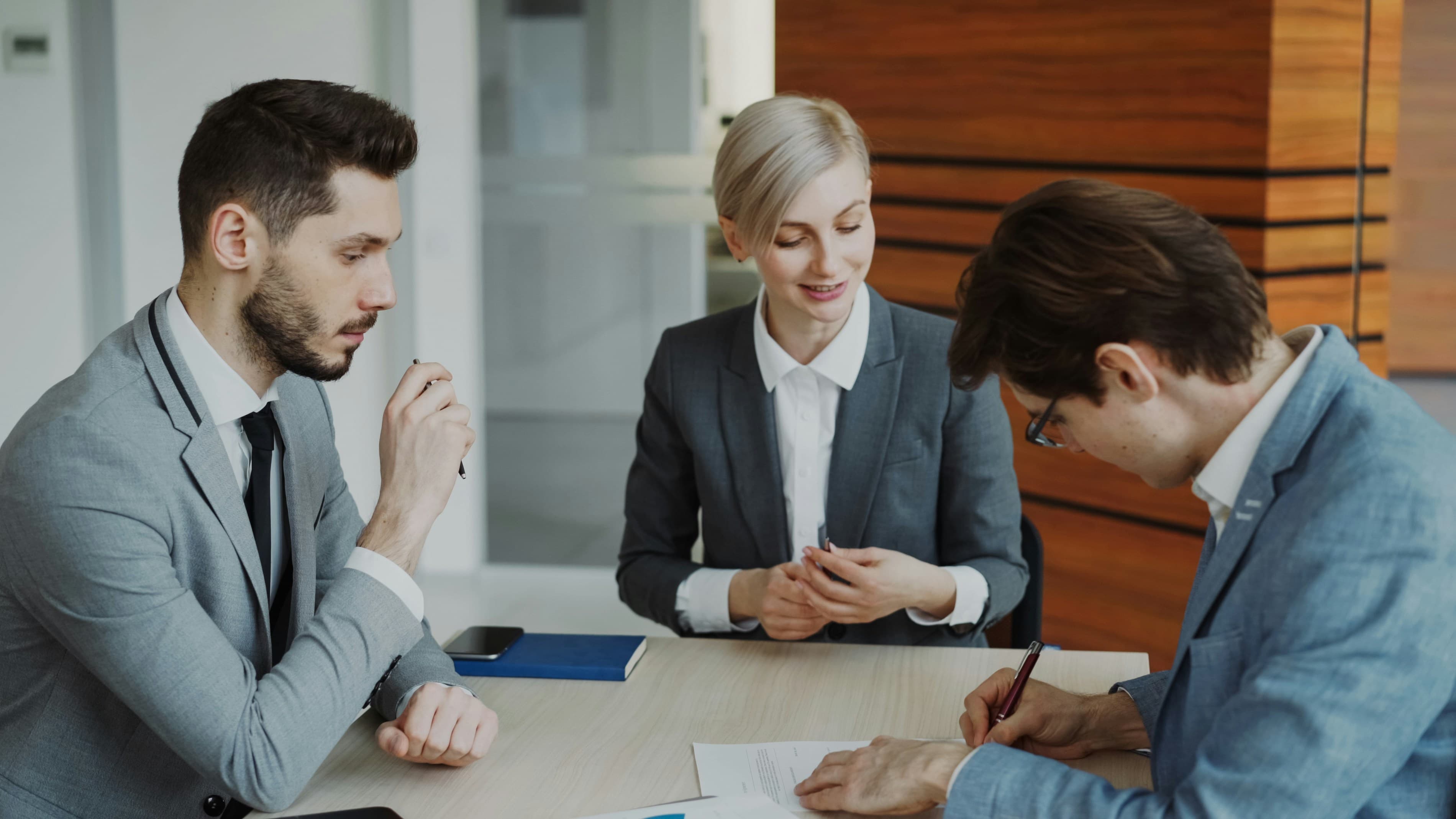 Couple meeting with an attorney to discuss financial planning