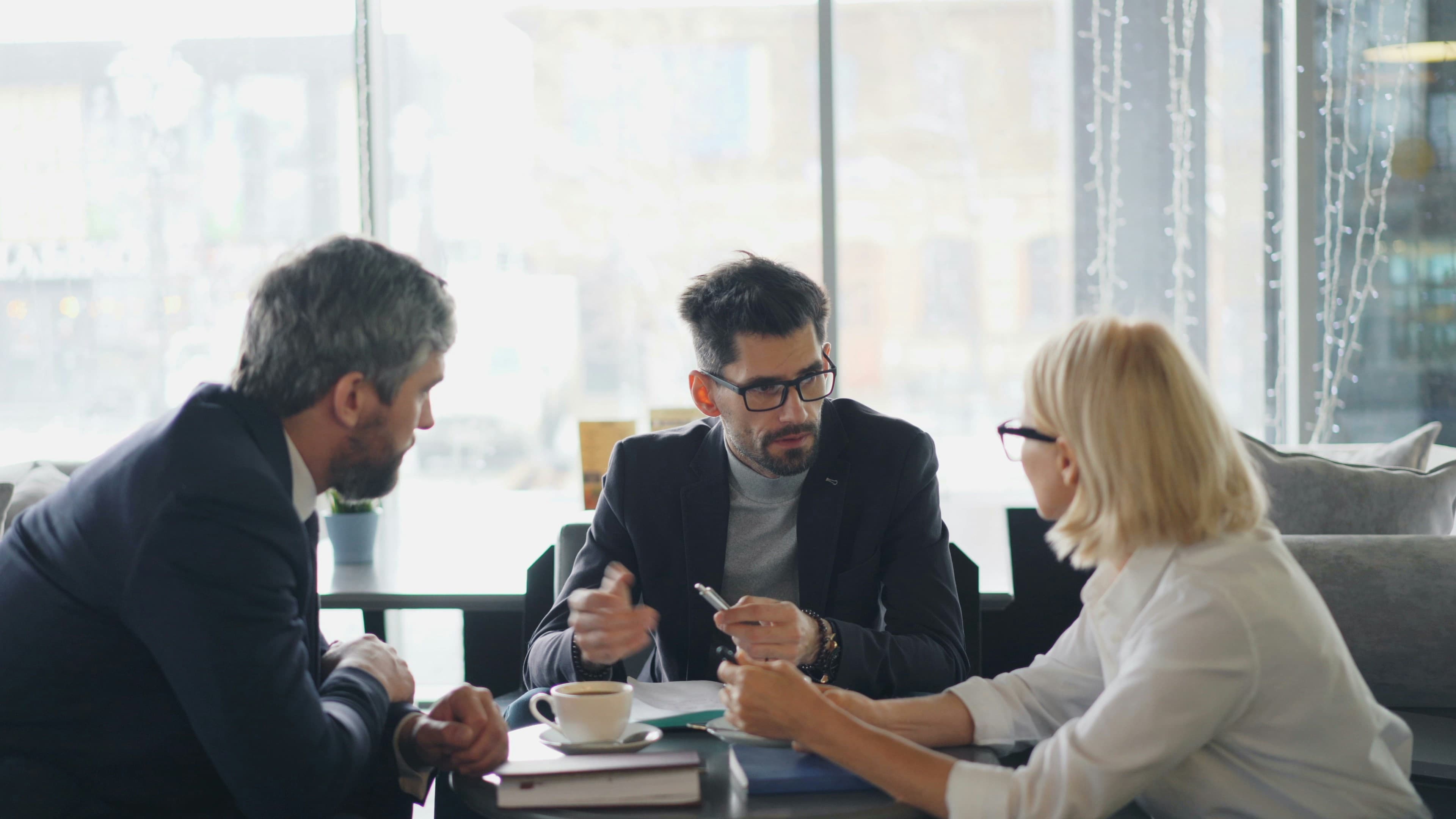 Attorney consulting with clients about spousal support arrangements